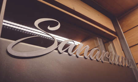 sanarium sauna volumetric lettering decoration inscription at the spa hotel. Entrance sign sanarium type at the wellness center, closeup.の写真素材