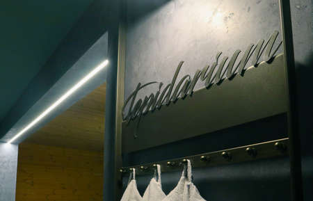 Tepidarium volumetric lettering decoration inscription at the spa hotel. Entrance sign Tepidarium title type at the wellness center, closeup.の写真素材