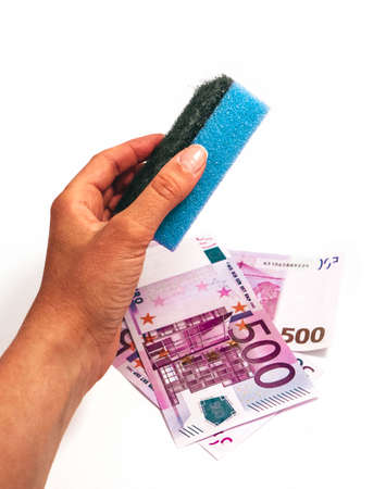 Dirty money wash laundry, corruption concept. Euro money cleaning with washing sponge in a female...