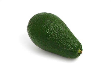 Delicious fresh ripe green avocado isolated on a white background, natural shadow.の写真素材