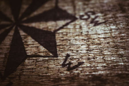 A Rose of Wind hand drawn on the wooden texture.の写真素材