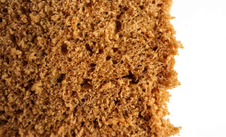 A piece of handmade freshly baked rye bread, texture background, closeup.の写真素材