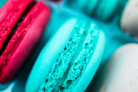 Assorted macaroons sweets, close up, backdrop. Marine, pink and violet.の写真素材
