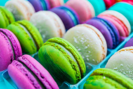 Assorted macaroons sweets, close up, backdrop. Marine, pink and violet.の写真素材