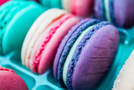 Assorted macaroons sweets, close up, backdrop. Marine, pink and violet.の写真素材