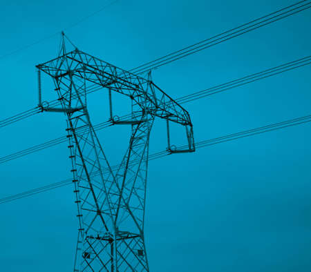 High voltage electricity tower with wires, landscape. photo depicting one high voltage powerful tower with wires on cloudy green moody evening sky. European city.の写真素材