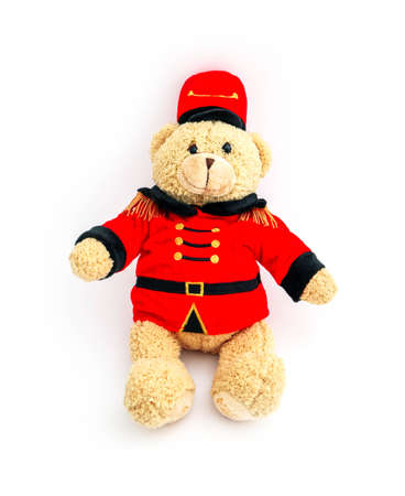 Teddy bear in a traditional British royal guardian Beefeater costume, isolated on white background.の写真素材