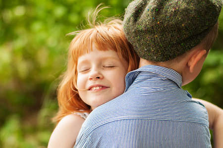  Little boy and girl on nature