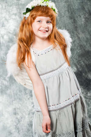  Little girl in a dress and a wreath of flowersの写真素材