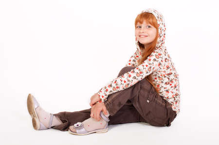  Little redheaded girl on a white backgroundの写真素材