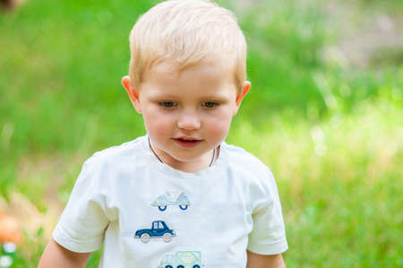 Child walking in the park with a toyの写真素材