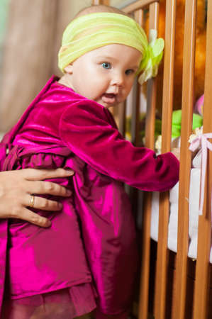 Little girl in a beautiful dress at home の写真素材