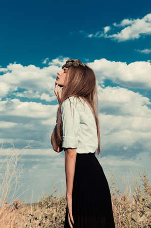 beautiful model girl in a summer fieldの写真素材