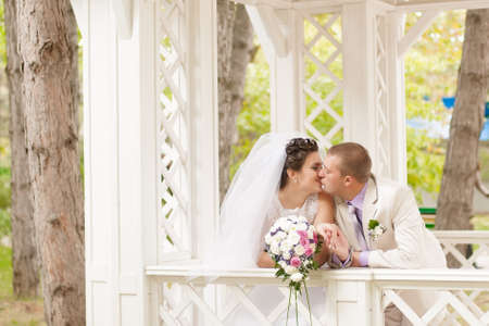 Young and beautiful bride and groom smillingの写真素材