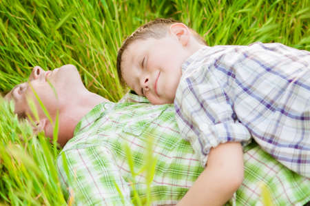 father and boy on a summer natureの写真素材