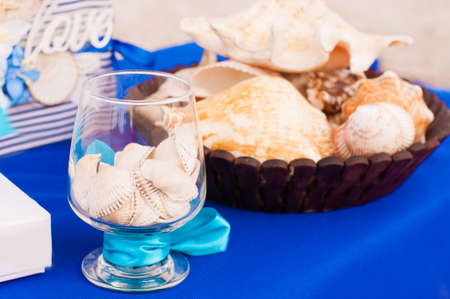 Decoration on the marine theme with seashells and glassesの写真素材