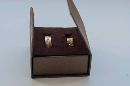 gold wedding rings near gift boxes