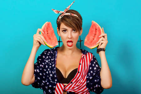 Young beautiful girl with watermelon in hands
