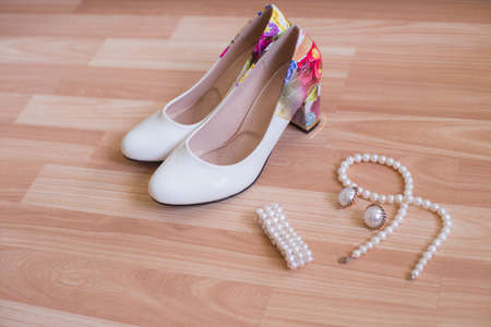 Wedding shoes bracelet and earrings a necklace of pearlsの写真素材