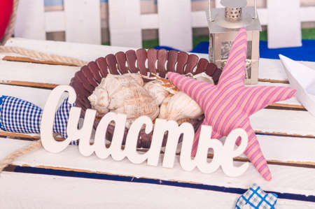 Maritime decor paper boats, shells and toysの写真素材