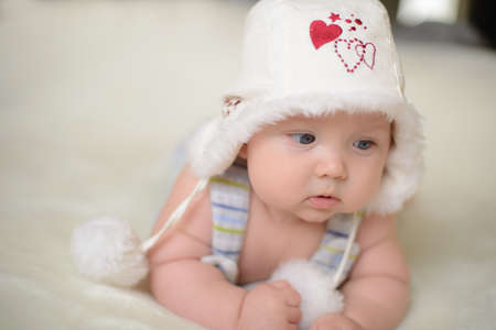 Little baby on the bed at homeの写真素材