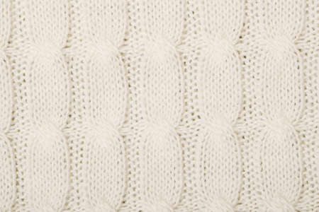 White knitted texture with ornament braid