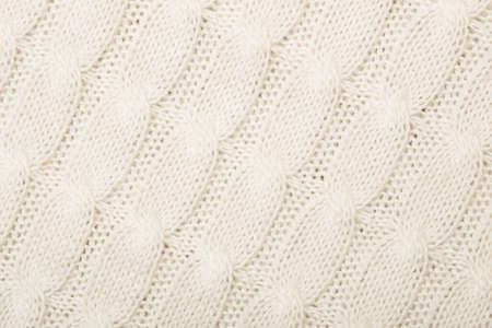 White knitted texture with ornament braidの写真素材