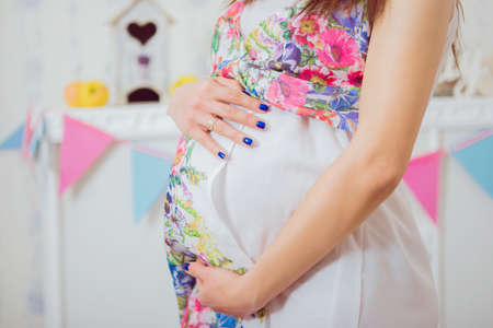 Pregnant woman's belly. Women's Health and Pregnancyの写真素材