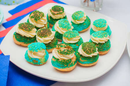Cupcakes, cakes and holiday cookies for a children's holiday. Festive treats for children's parties