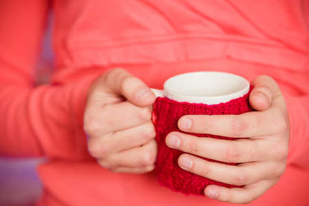 Female hand with a cup of teaの写真素材