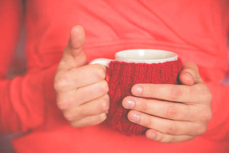 Female hand with a cup of tea