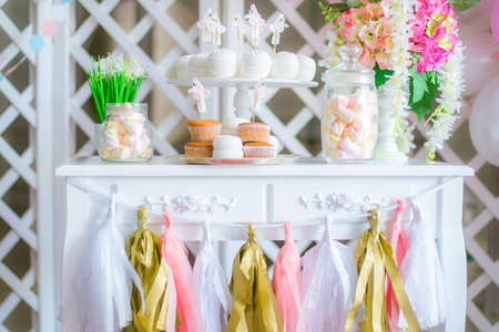 Candy bar in pink colors for a children's party. Decorated with airy bright balloons baby candy barの写真素材
