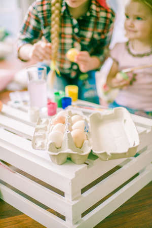 Lovely sister girls. Colorful preparations for the Easter holiday. The children are having funの写真素材