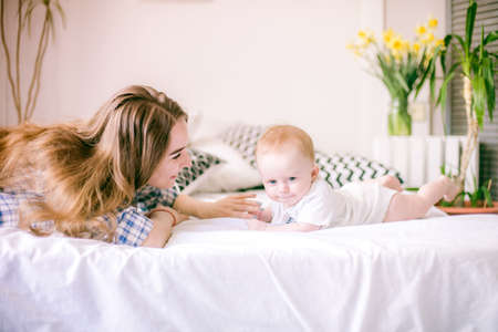 mom playing with her baby boy