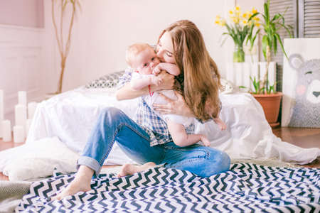 mom playing with her baby boyの写真素材