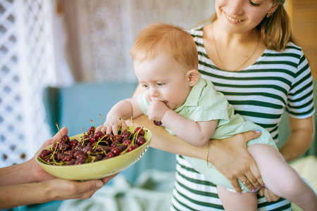 little baby with cherryの写真素材