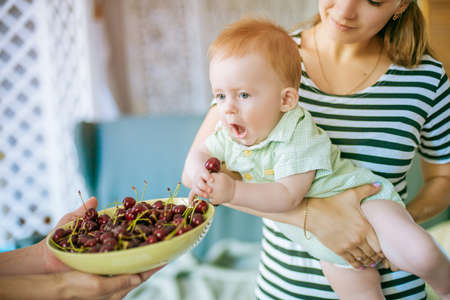 little baby with cherryの写真素材