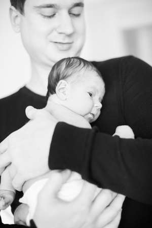 father holding newborn babyの写真素材