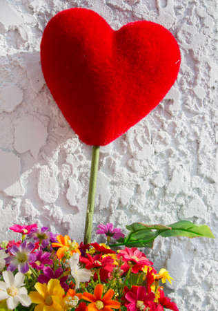 red hearth with colorful flowerの写真素材