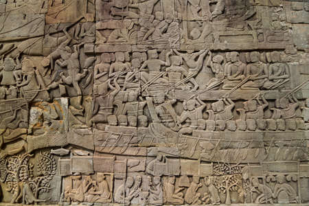 The bas relief of Cambodian culture on Bayon temple wall.の写真素材