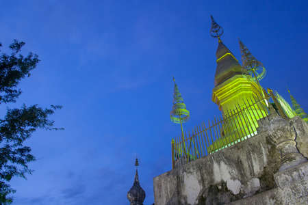 The old golden pagoda at Luang Prabang,Laos in the sunset time.の写真素材
