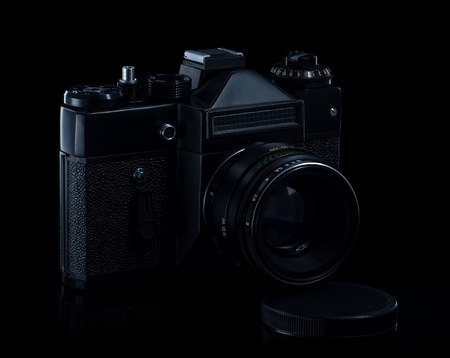Slr camera on the black background in low key lightの写真素材