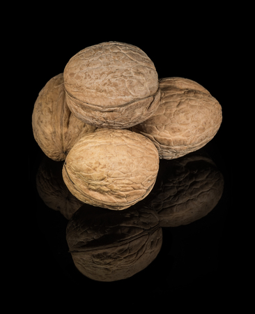 Walnut on the black background with reflection