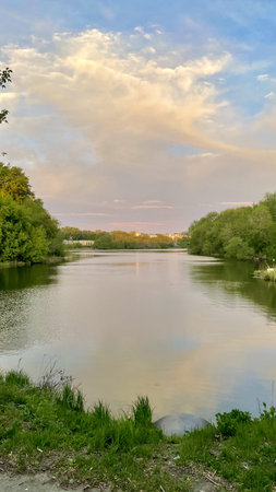 A landscape with a view of the river and the sunset
