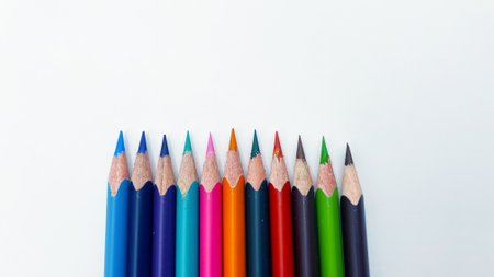 Lots of colored sharpened pencils on a white backgroundの写真素材