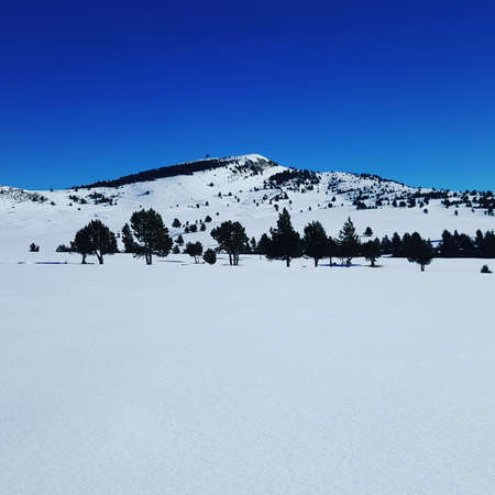Snowed mountain with clear sky in spain