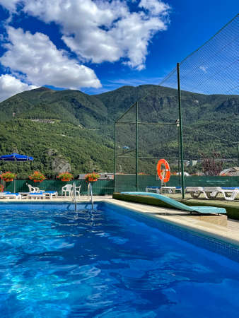 landscape view of swimming pool and top of mountain view at sunny day, vertical photoの写真素材