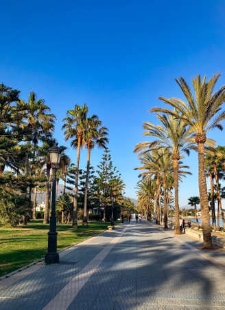seafront promenade in the sunny day. Marbella resort city. Malaga, Costa del Sol. Southern Spain.の写真素材