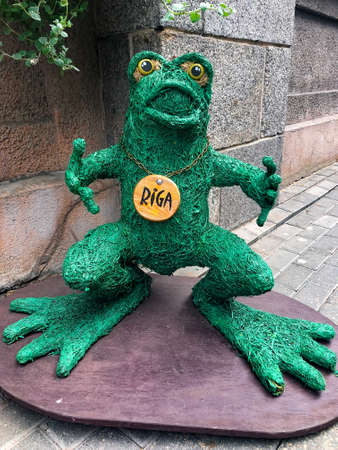 frog figurine on a street in Riga, Latvia.