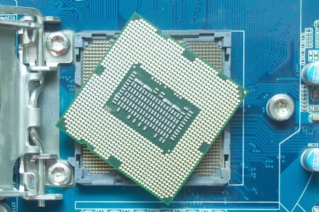Central processor unit (CPU) and his socket on motherboard. Technical, electricity and IT concept